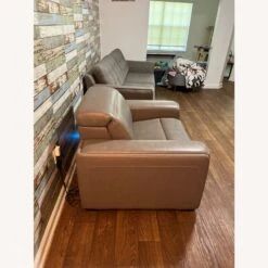 Ashley Furniture Beige Leather Power Recliner -Othe Furniture Store 1500 1500 frame 0 1932